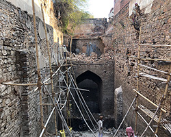 A group of people standing outside of a building